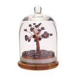 Garnet Gemstone Tree Dome Ornament featuring a copper-wire tree with purple garnet stones under a clear arched glass dome on a round wooden base, set against a white background.
