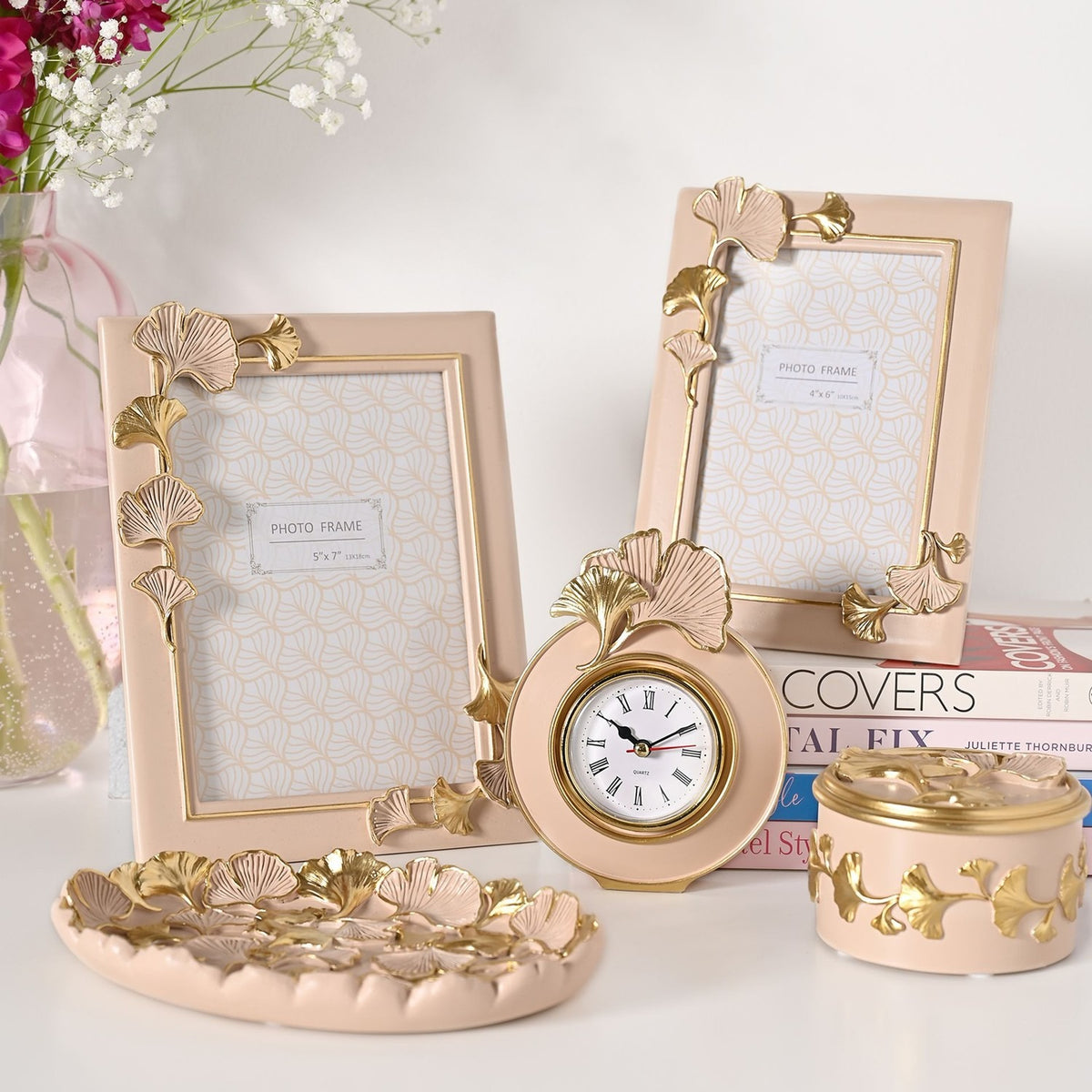 Classic Ginkgo Resin Photo Frames in pink with gold and pink leaf details, shown with a matching clock, trinket box and tray in a home decor display.