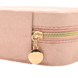 Close-up of the Classic Rectangular Velvet Jewellery Box in pink, showing the gold-tone zip and round zip pull against the stitched velvet edge.