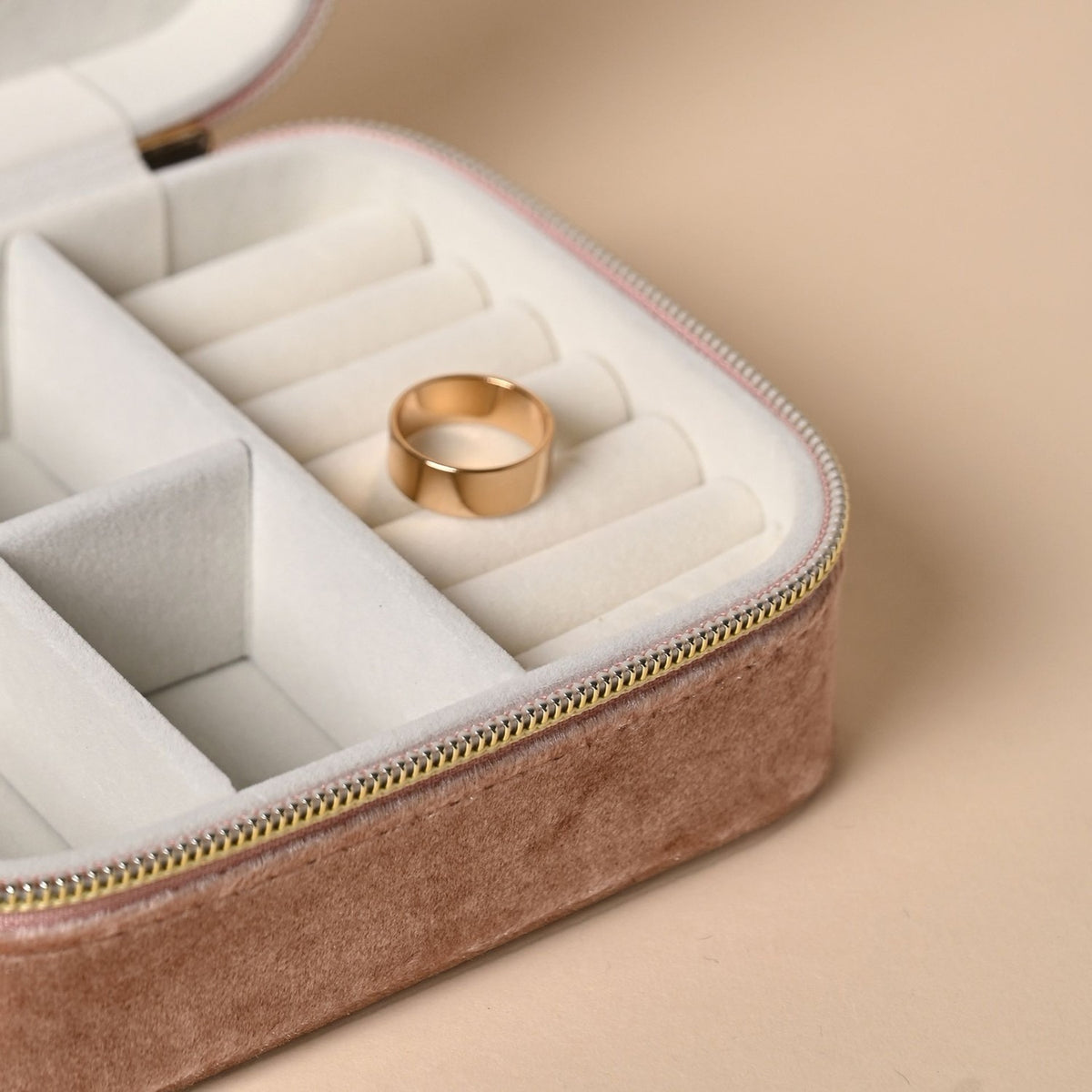 Classic Rectangular Velvet Jewellery Box in pink, open to show a cream lining with a padded ring roll and compartments, gold-tone zip, and a gold ring displayed inside.