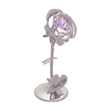 Silver metal rose figurine with faceted lilac crystal centre, veined leaves, and a heart-shaped plaque engraved "Thank You" on a round base, shown on a plain white background.