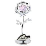 Silver metal rose figurine with faceted lilac crystal centre, veined leaves, and a heart-shaped base plaque engraved "Thank You", on a plain white background.