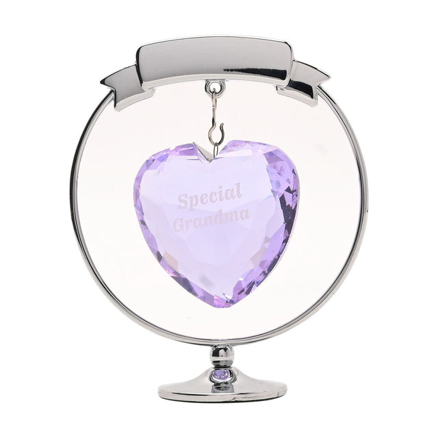 Chrome plated circle and heart decoration with a faceted lilac heart engraved "Special Grandma" hanging beneath a ribbon banner, set on a round stand, shown on a white background.