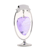 Special Grandma circle and heart decoration with a chrome-plated oval frame and curved banner holding a faceted lilac heart, set on a slim stem with a round foot, against a plain white background.