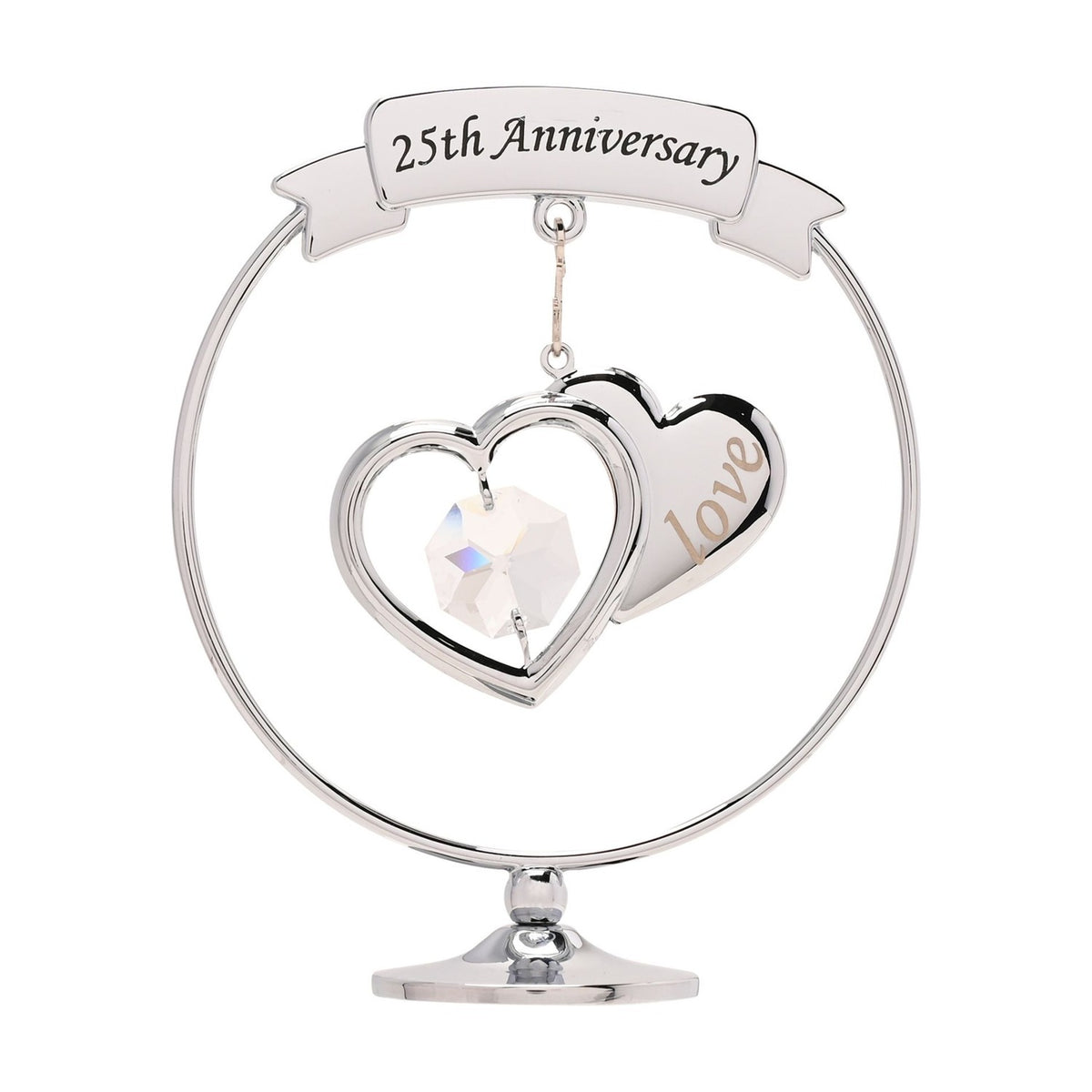 Chrome circle decoration on a round pedestal base, featuring a "25th Anniversary" ribbon banner above two overlapping silver hearts with a clear crystal drop, set against a plain white background.