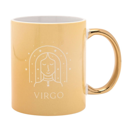 Yellow stoneware mug with gold handle, featuring a white line illustration of Virgo's face under a starry arch and "VIRGO" text, shown on a plain white background.