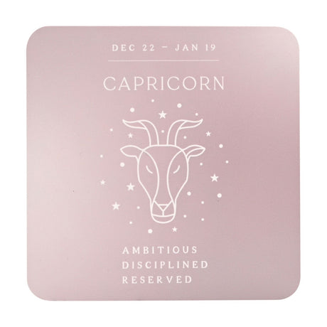 Square wooden coaster in warm grey with white Capricorn goat head line art, star accents, dates Dec 22–Jan 19, and the words Ambitious, Disciplined, Reserved.