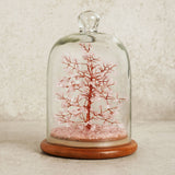 Gemstone Dome Tree figurine with copper wire branches and 200 pink gemstone beads, set on a pink crystal base under a glass dome with a round wooden stand.