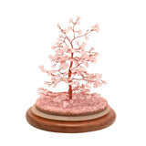 Gemstone Dome Tree figurine with a copper-wire trunk and branches holding 200 pink gemstone beads, set on pink chip gravel atop a round wooden base, shown on a plain white background.