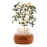 Aventurine LED Glow Tree with gold wire branches, green chip leaves in drooping tiers, and a pale crystal cluster base on rounded brown wood, shown on white.
