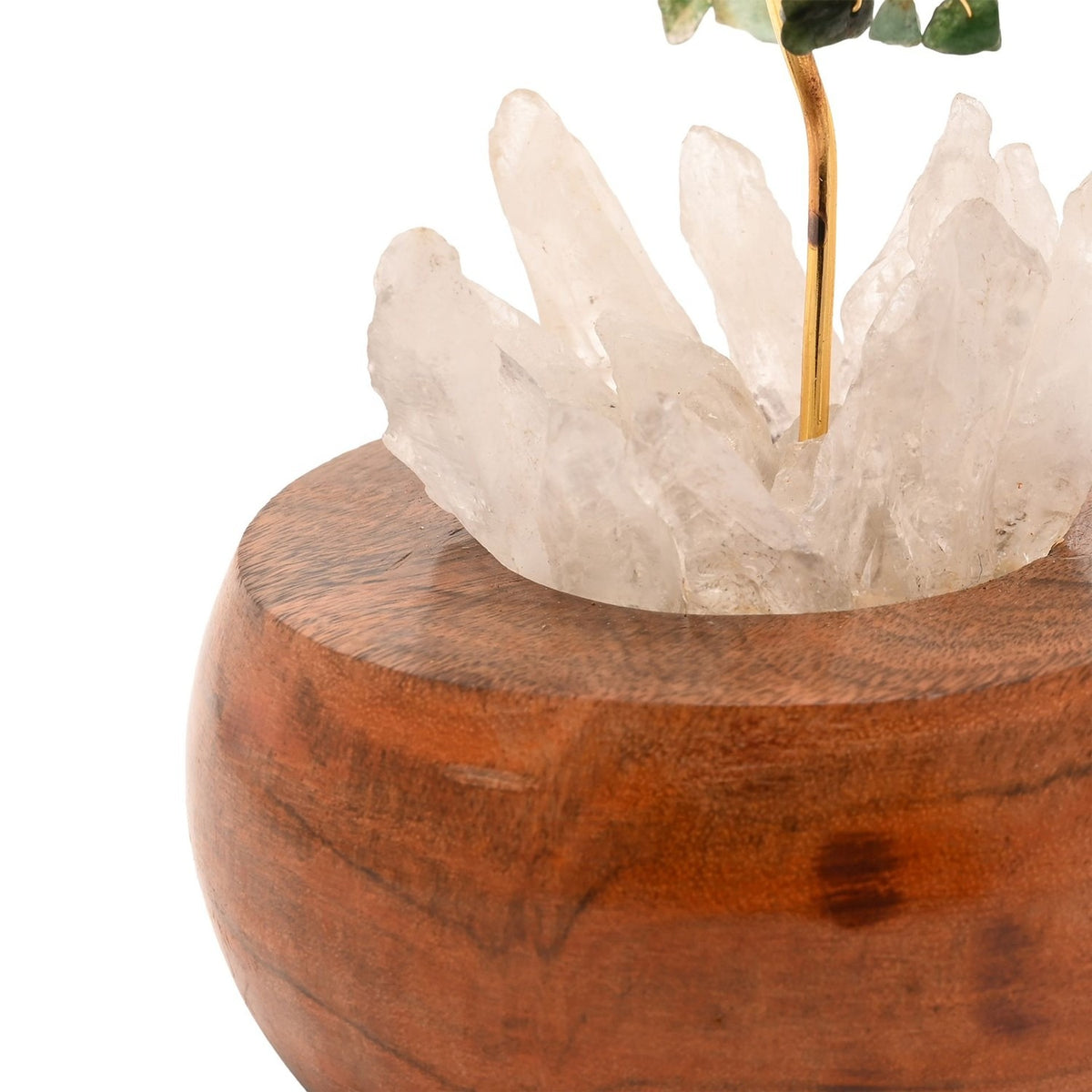 Close-up of the Aventurine LED Glow Tree's base, showing gold branches rising through pale crystal points set into a rounded brown wooden bowl.
