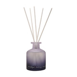Amethyst Crystal Infused Oil Reed Diffuser 230ml with a frosted glass bottle shading from soft purple to black, five white reeds, and handwritten script text, shown on a plain white background.