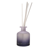 Amethyst Crystal Infused Oil Reed Diffuser 230ml in a frosted glass bottle shading from soft purple to near-black, with white reeds and handwritten script, on a plain white background.