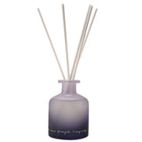 Amethyst Crystal Infused Oil Reed Diffuser 230ml with a frosted bottle shading from soft purple to black, white reeds fanning out, and handwritten script text, on a plain white background.