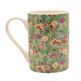 Floral Print Porcelain Mug 10oz with a cream handle, rim and interior, featuring pink, purple, red and cream blooms over a green ground, shown on a plain white background.