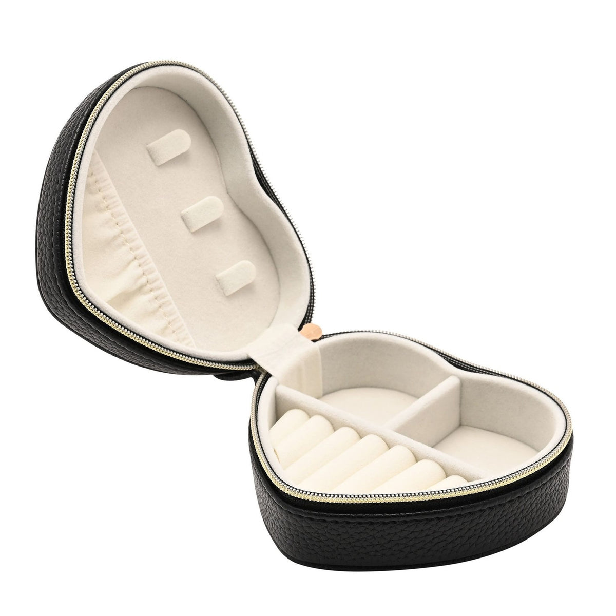 Heart-shaped jewellery box in black pebbled-grain plastic with gold-tone zip, open to show cream lining with earring studs, ring rolls, and divided compartments, on a white background.