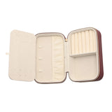 Open view of the Medium Rectangular Plastic Jewellery Box in red, showing a cream-lined interior with a ring roll, zipped pocket, elastic loops and a mirrored, perforated lid panel for earrings.