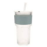 Ribbed cold drink tumbler with clear fluted glass body, fitted lid, clear straw and a blue sleeve with stitched edges, shown on a plain white background.