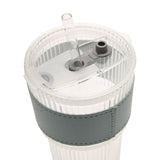 Close-up of a ribbed clear tumbler's flip-top lid with built-in straw opening and clear straw, grey sleeve with stitched edge, on a plain white background.