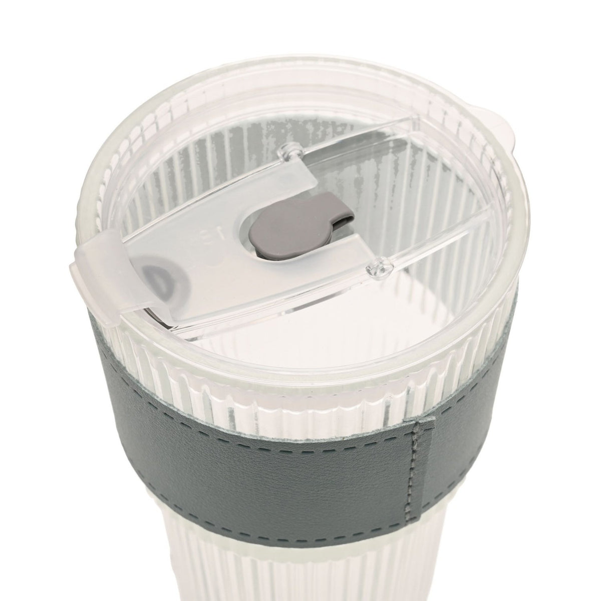 Close-up of the ribbed cold drink tumbler's clear lid with sliding closure and straw slot, showing the fluted clear body and grey sleeve, on a plain white background.