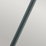 The Stockholm 1 Light Pillar - Black, a sleek cylindrical object embodying Scandinavian design, is positioned diagonally against a plain, light gray background.