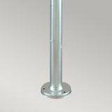 Against a plain background, the Stockholm 1 Light Grande Lamp Post in silver stands as a metallic cylindrical pole that echoes the classic aesthetic of a traditional Stockholm Lamp Post. Crafted from galvanized steel, it boasts a smooth and shiny finish. Its round base is designed with two visible holes for mounting, making it perfect for secure outdoor lighting installations.