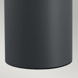 A close-up view of the Stavanger LED Medium Bollard in a graphite matte finish set against a light gray background. The smooth surface of this weather-resistant cylinder curves down to an invisible base, ensuring durability and style in any setting.