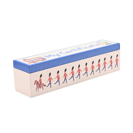 Rectangular wooden keepsake box with a blue pinstriped lid reading "My Certificate" and a white body printed with marching London guardsmen led by one on horseback, shown on a plain background.
