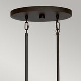 A close-up view of an Olde Bronze ceiling canopy and rods with two adjustable chains highlights the simple, industrial design that complements the Taiko 5 Light Island Suspension Light, set against a neutral background.