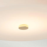 The Tamar 1 Light Large Flush in Polished Gold emits a soft, warm glow against a plain ceiling. This energy-efficient lighting solution features a circular design with a simple polished gold mount at the center, creating a calming ambiance.