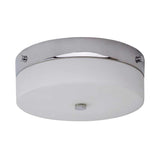 The Tamar 1 Light Medium Flush in polished chrome showcases a contemporary design with an opal glass diffuser and a streamlined frame. Its minimalist style includes a circular cover complemented by a central mounting knob, providing both elegance and functionality.