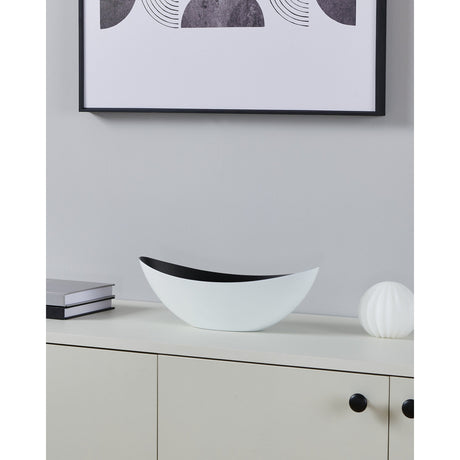 Tazeyol Planter 11cm in white, a boat-shaped oval bowl with a black interior, shown on a sideboard beside books and a decorative sphere.