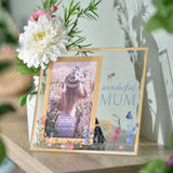 Glass photo frame with gold edge holding a 6 x 4in portrait photo, "wonderful MUM" text, wildflowers, a bee and butterfly, displayed on a shelf.