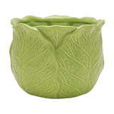 Small round stoneware planter shaped like a cabbage, with moulded green leaves and raised veins wrapping the sides below a scalloped rim, glossy glaze, on a plain white background.