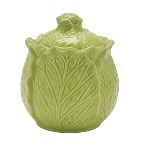 Green glazed stoneware sugar bowl with lid shaped as a cabbage head, with raised veined leaves and a wavy rim, on a plain white background.