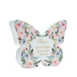 White wooden butterfly mantel decoration with pastel pink, blue and cream watercolour flowers and gold "Mam never forget how loved you are" text, shown against a plain white background.