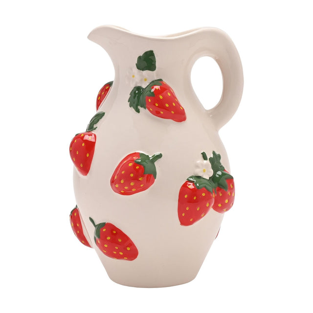 White stoneware jug vase with raised hand-painted red strawberries, green leaves, and white blossoms, featuring a wavy spout and curved handle on a plain background.