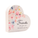 White wooden heart-shaped freestanding plaque with pastel floral watercolour design and "Friends Like YOU, are PRECIOUS and few" script, shown on a plain background.