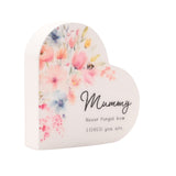 White wooden heart-shaped mini plaque with pastel watercolour florals and a bee, reading "Mummy, Never forget how LOVED you are" on a plain background.