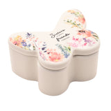 White butterfly-shaped glass trinket box with lift-off lid, printed with watercolour garden flowers and a bee, reading "Sisters ALWAYS friends FOREVER" on a plain background.