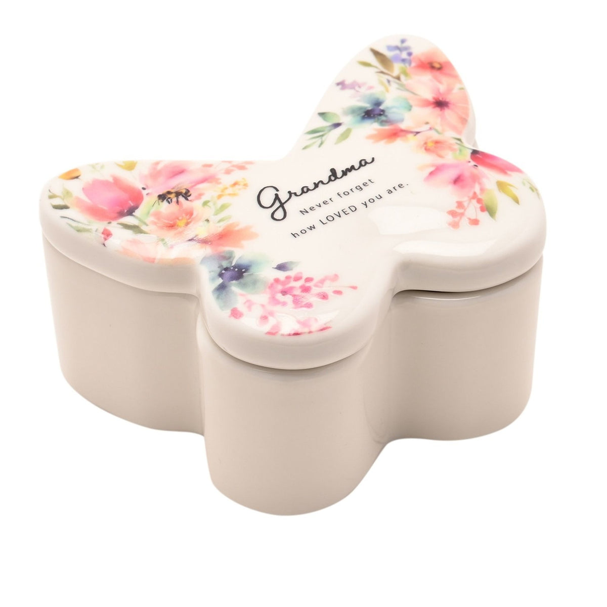 White butterfly-shaped glass trinket box with floral lid reading "Grandma, Never forget how LOVED you are," on a plain white background.