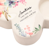 Close-up of the white glass butterfly tealight candle holder, wing detail with watercolour floral print and "Aunties Like YOU, are PRECIOUS and few" script, tealight cup visible.