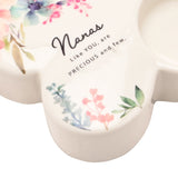 White glass butterfly tealight candle holder with watercolour floral design and "Nanas Like YOU, are PRECIOUS and few" script, close-up detail with tealight cup.
