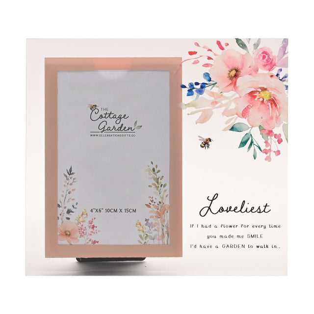 Freestanding glass photo frame with a peach-pink bordered portrait opening, watercolour pink floral and bee design, and "Loveliest" script text, for a 4x6in photo.
