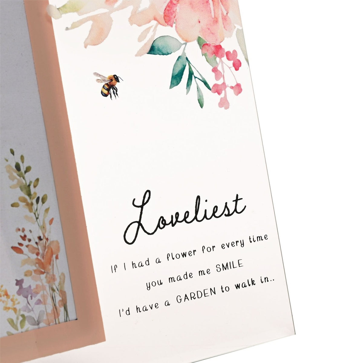 Loveliest Floral Bee freestanding glass photo frame with a peach-pink border, watercolour florals, a bee motif, and "Loveliest" script with verse text, pictured in close-up.