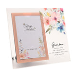 Clear glass photo frame with peach-edged 6 x 4in opening, watercolour floral and bee design, and "Grandma" verse printed beside it on a white background.