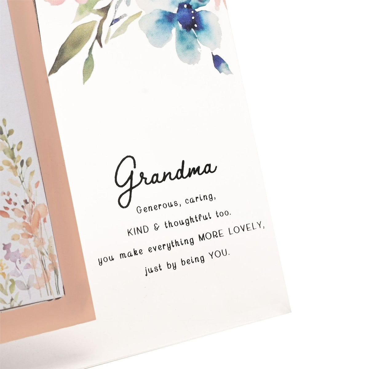 Close-up of the Grandma Floral and Bee Glass Photo Frame 6 x 4in, showing a peach-bordered photo opening beside blue watercolour flowers and the printed verse beneath "Grandma" in script.