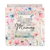 Square clear glass tealight candle holder printed with pastel watercolour wildflowers and a bumblebee, reading "Loveliest Mummy", set against a plain white background.