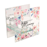 Square glass tealight candle holder with "LOVELIEST Mummy" print, pastel floral design and a small glass tealight cup, set on a plain white background.