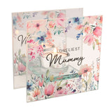 Square clear glass tealight candle holder printed with pastel floral watercolour blooms and "LOVELIEST Mummy" text, shown lit on a plain white background.
